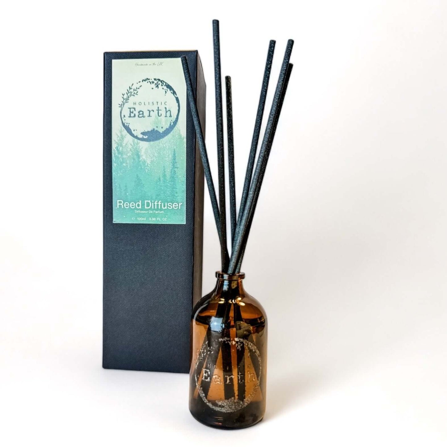 A small Holistic Earth reed diffuser with packaging.